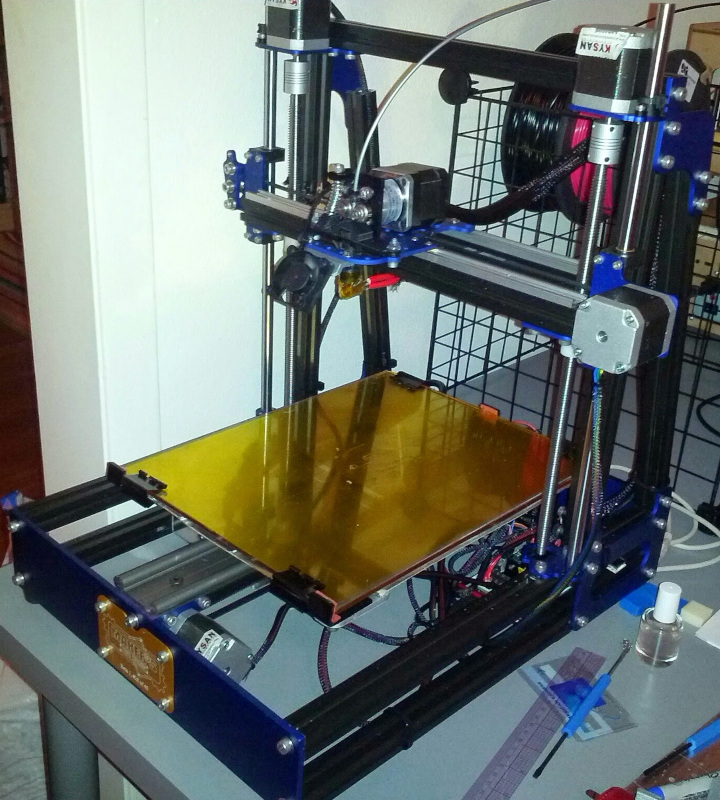 MendelMax 2 shortly after kit assembly on my project table. Filament behind and a few tools
  to the right.
